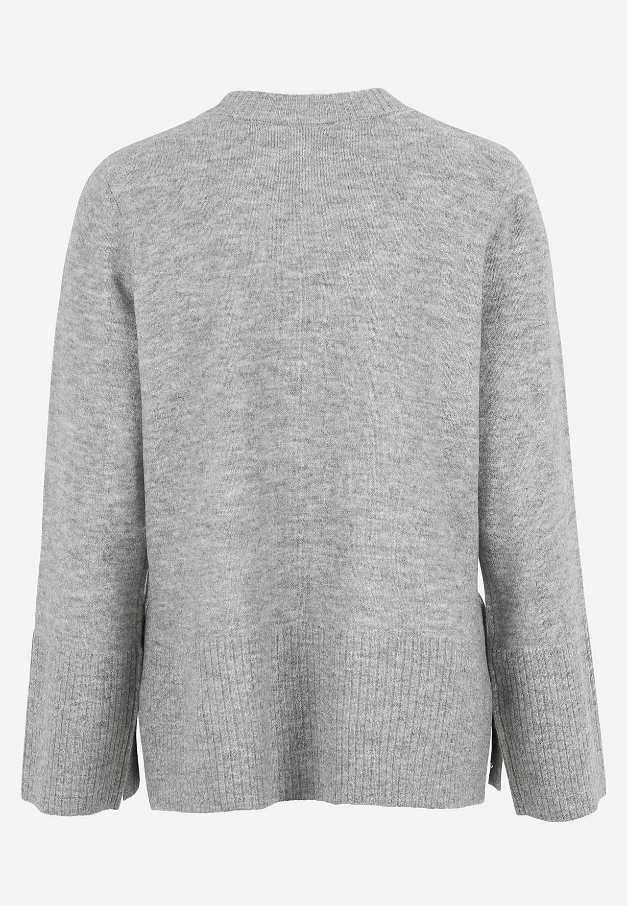 Dzianinowy sweter z rozcięciami